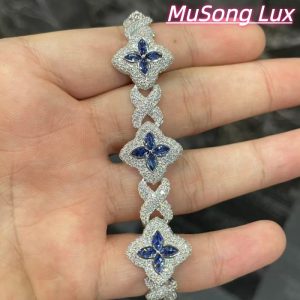 VVS Moissanite 925 Sterling Silver Miami Bracelet 9mm 8 inches, set with blue gemstones.
